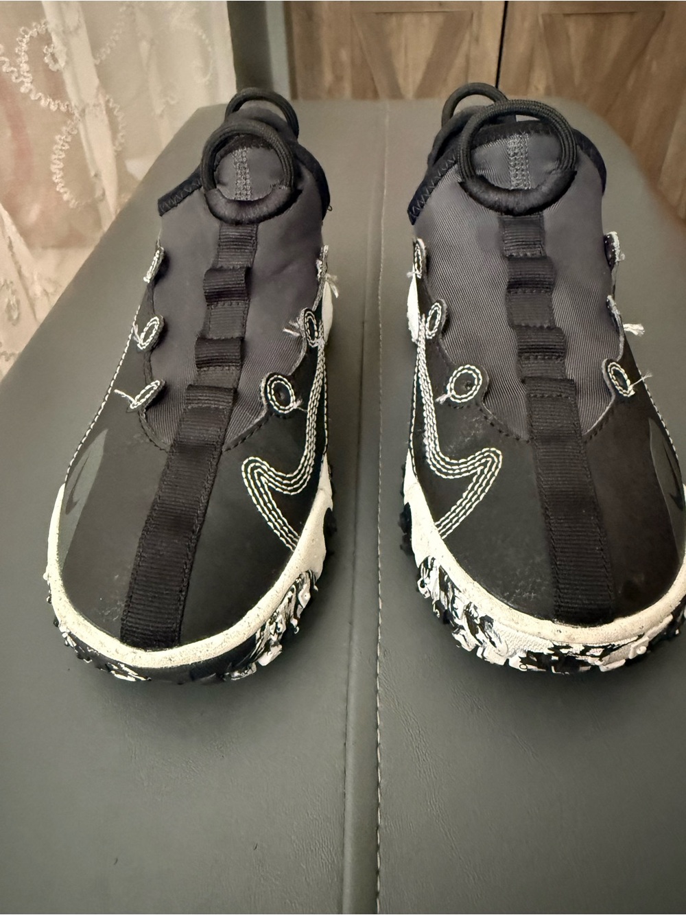 Nike Women’s Black and White Slip-On Athletic Sneakers